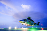 helicopter parking landing on offshore platform. Helicopter transfer crews or passenger to work in offshore oil and gas industry.Night flight training of Pilot and coordinate pilot.