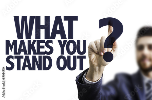 Fényképezés  Business man pointing the text: What Makes You Stand Out?