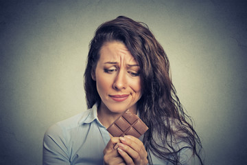 sad young woman tired of diet restrictions craving sweets chocolate