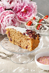 Wall Mural - Carrot vegan cake with coconut icing and dried wild rose petals