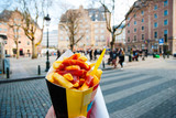 Fototapeta Tęcza - Holding typical belgian fries in hand in Brussels