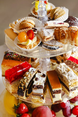 Sticker - Assorted cakes, cookies and fruits on glass cake stand