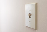 Fototapeta Miasta - Classic light switch hanging on the wall