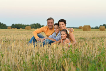 Wall Mural - Happy family in wheat field