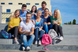 © .shock - students outside sitting on steps