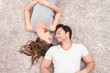© zinkevych - Pleasant couple lying on the carpet