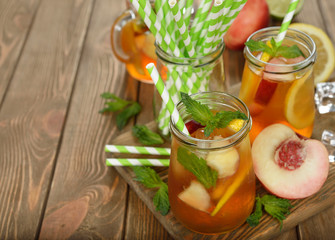 Wall Mural - Ice tea with lemon, peach and mint