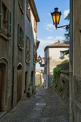 Fototapete - Beautiful little streets of San - Marino waiting for tourists.