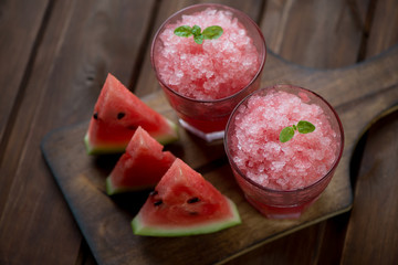 Poster - Watermelon granitas and watermelon slices, rustic wooden surface