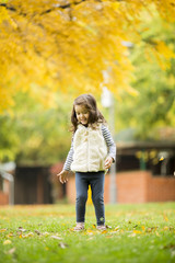 Wall Mural - Little girl at the autumn park