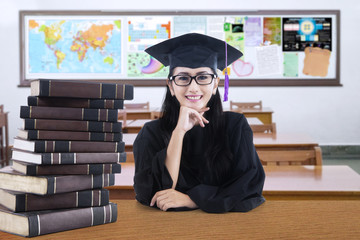 Wall Mural - Graduate student sitting and smiling in the class