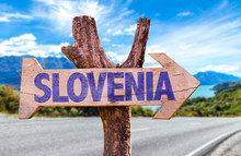 Slovenia Wooden Sign With Road Background