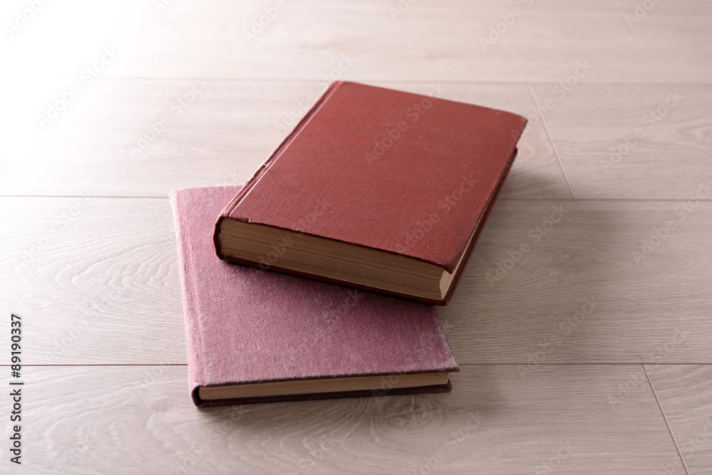 Old books on wooden background
