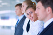 © lenets_tan - Smiling successful business team standing in office