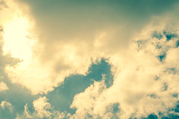 Wall Mural - sun behind white clouds
