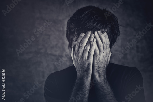 Fotografia Grief, man covering fsce and crying