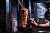 Fototapeta Młodzieżowe - cutting doner meat in a street restaurant in istanbul