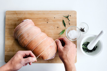 Wall Mural - Chef hands with raw meat pork roast cooking preparation