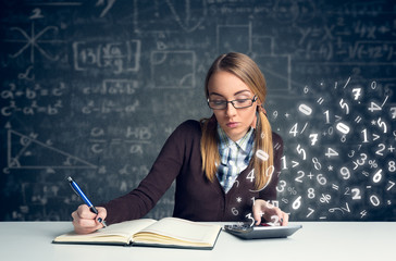 Schoolgirl doing  mathematics