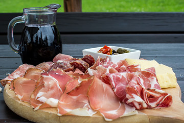 Wall Mural - typical Italian appetizer with salami, cheese and pickles