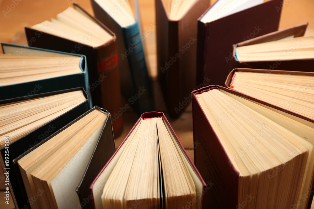 Heart of books, on wooden background