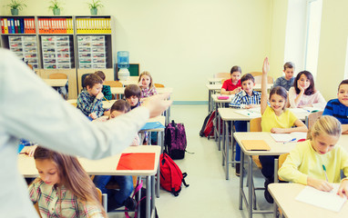 Poster - group of school kids raising hands in classroom