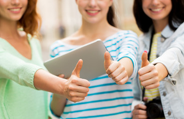 Wall Mural - women with tablet pc showing thumbs up