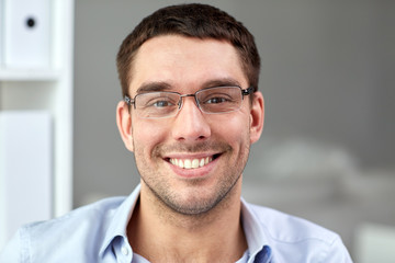 Poster - portrait of businessman in eyeglasses at office