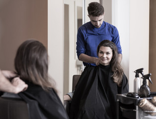 Wall Mural - Male hairdresser and attractive woman