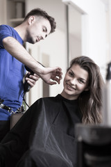 Wall Mural - Hairdresser drying woman's hair