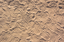 Tourist Footsteps In Sand