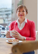 © DariaTrofimova - senior lady having  breakfast in   cafe.