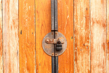 Old Rusty With Padlock On A Wooden Door