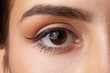 © nizas - Female eye close-up. Arrow makeup. Macro.