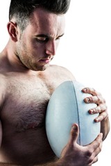 Wall Mural - Shirtless rugby player holding ball