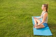 © WavebreakmediaMicro - Peaceful sporty blonde meditating on exercise mat