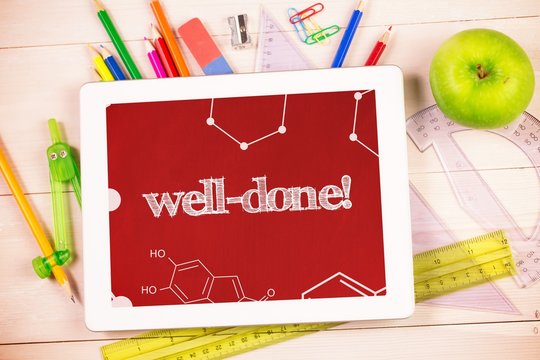 Well-done! against students desk with tablet pc
