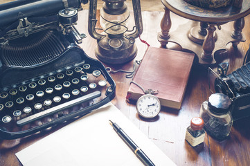 Vintage items, camera, pen, globe, clock, typewriter on the old