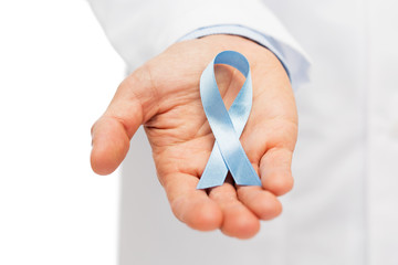 Wall Mural - doctor hand with prostate cancer awareness ribbon