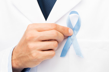 Wall Mural - doctor hand with prostate cancer awareness ribbon