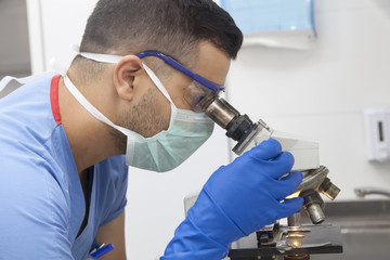 Doctor working on test tubes