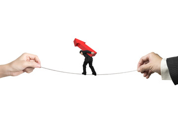 Poster - Businessman carrying arrow sign balancing tightrope with hands h