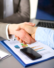 Wall Mural - Business people shaking hands, finishing up a meeting