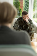 Wall Mural - Young soldier with depression