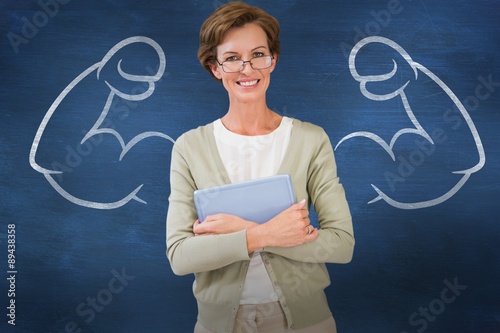 Cuadros en Lienzo Composite image of teacher holding tablet pc at library