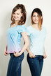 © artmim - Two Cute Girls Wearing T-Shirt. Fashion Portrait of Two Young Wo