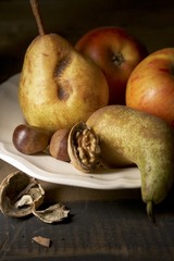 Wall Mural - Apples, pears and nuts on plate