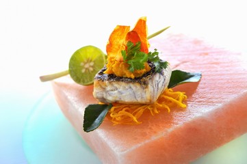 Wall Mural - Fish fillet with vegetables on a block of rock salt (Asia)