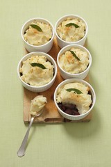Wall Mural - Beef goulash with cranberries topped with mashed potatoes