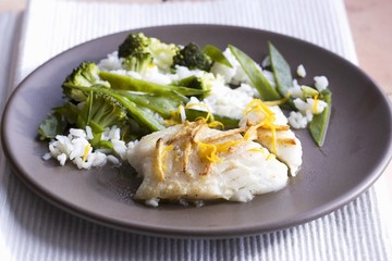 Wall Mural - Cod with ginger and orange sauce with vegetables and rice